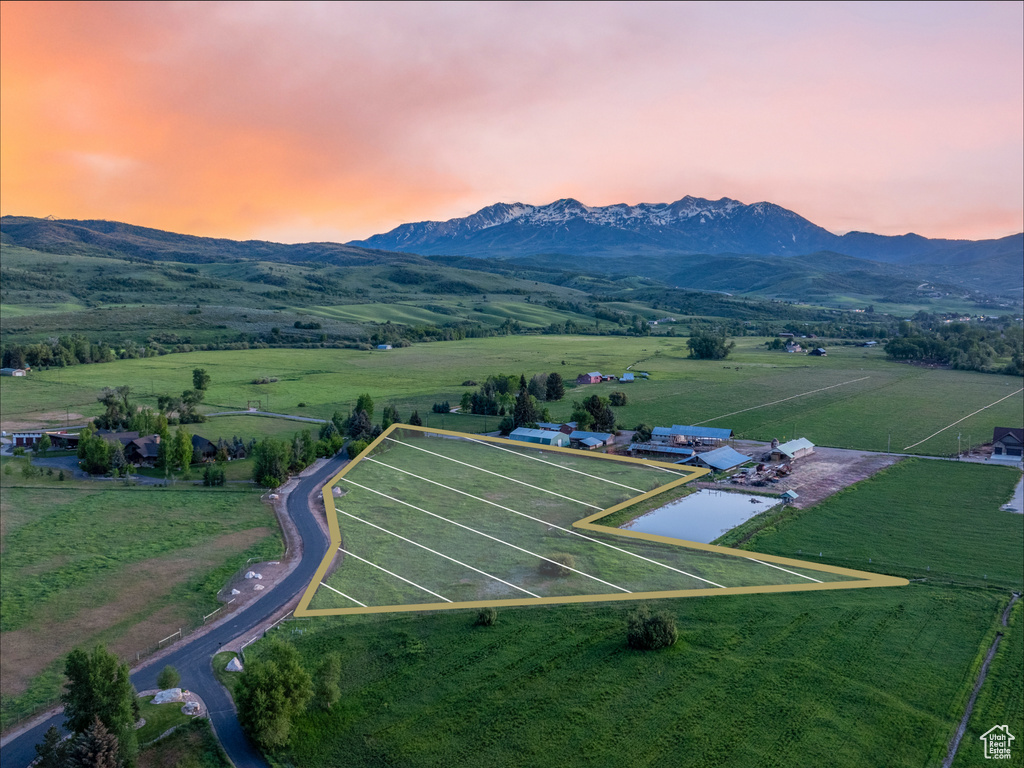 Aerial view at dusk of a view of rural / pastoral area and a mountain view