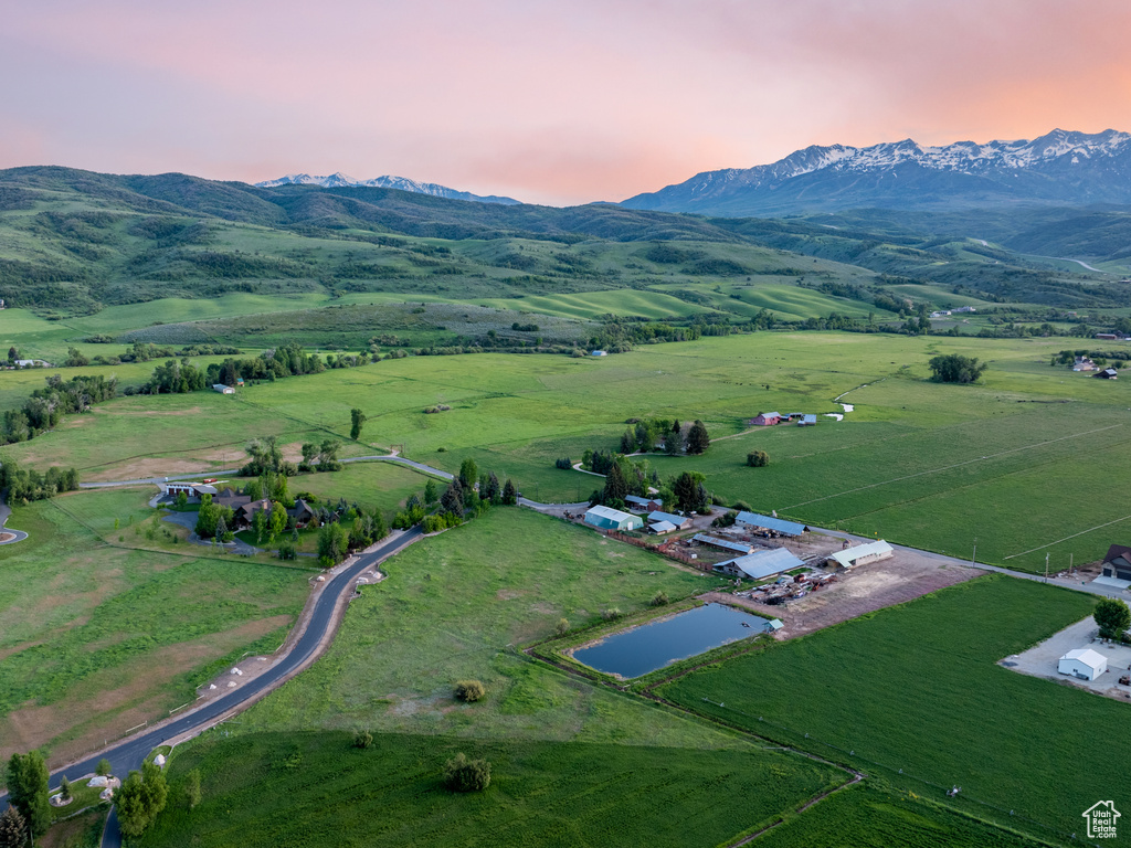 Aerial view at dusk of a mountain view and a rural view