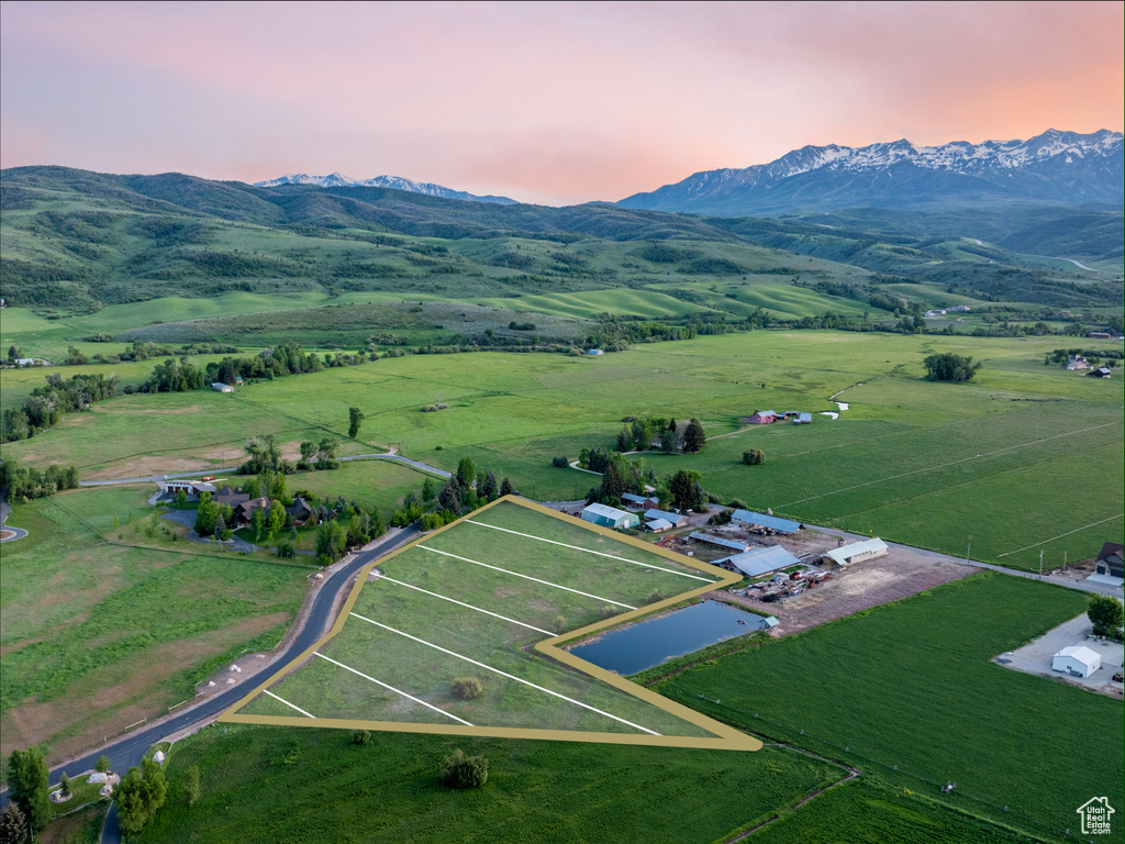 Aerial view of sparsely populated area with a mountain backdrop