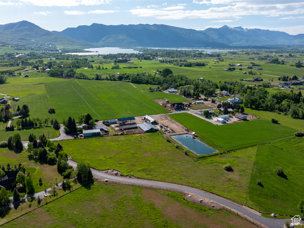 Overview of rural landscape with a water and mountain view and agricultural land