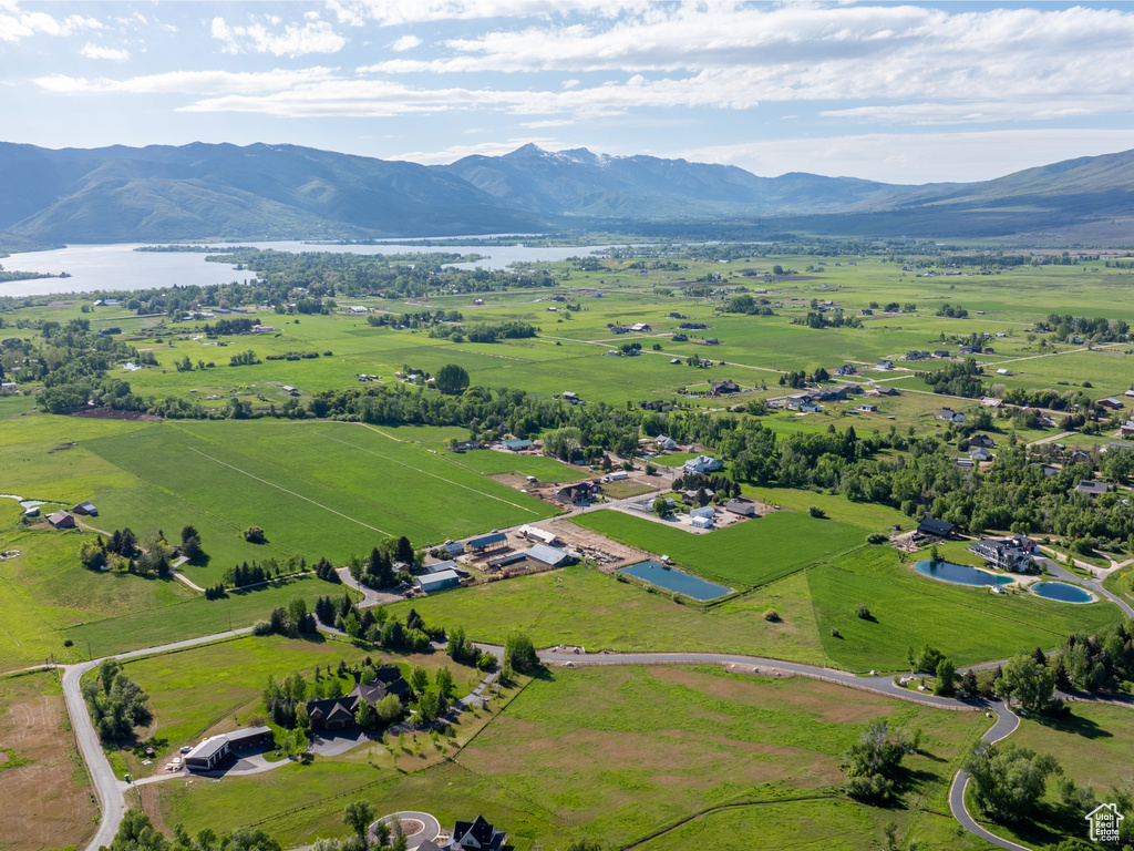 Overview of rural landscape featuring a water and mountain view