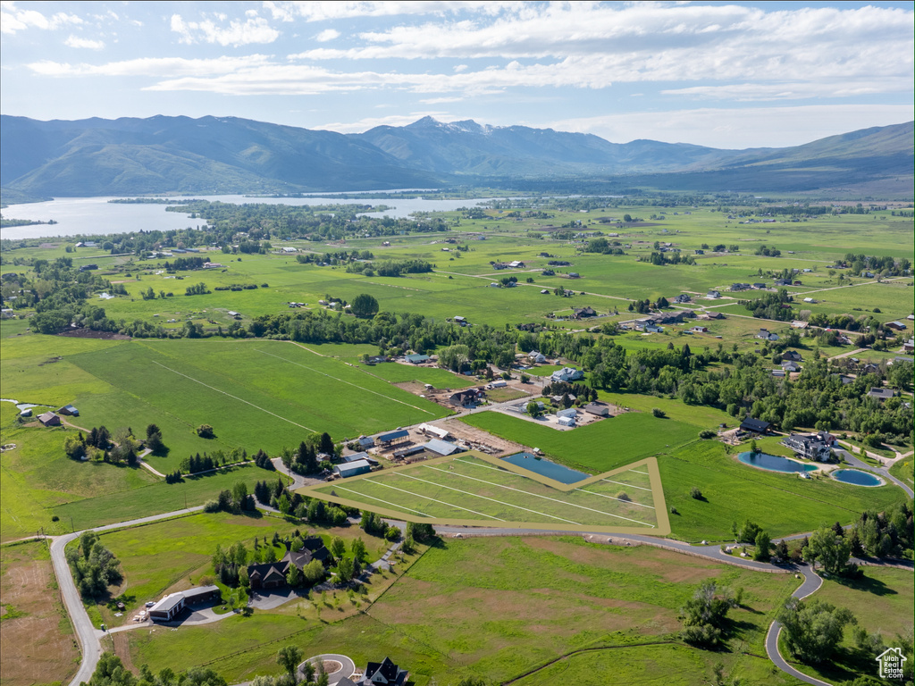 Overview of rural landscape featuring a water and mountain view