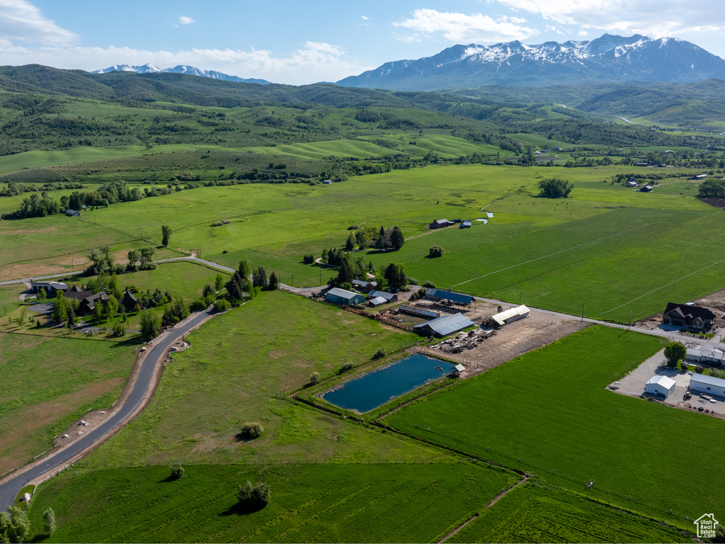 Aerial view of property\'s location with rural landscape and mountains