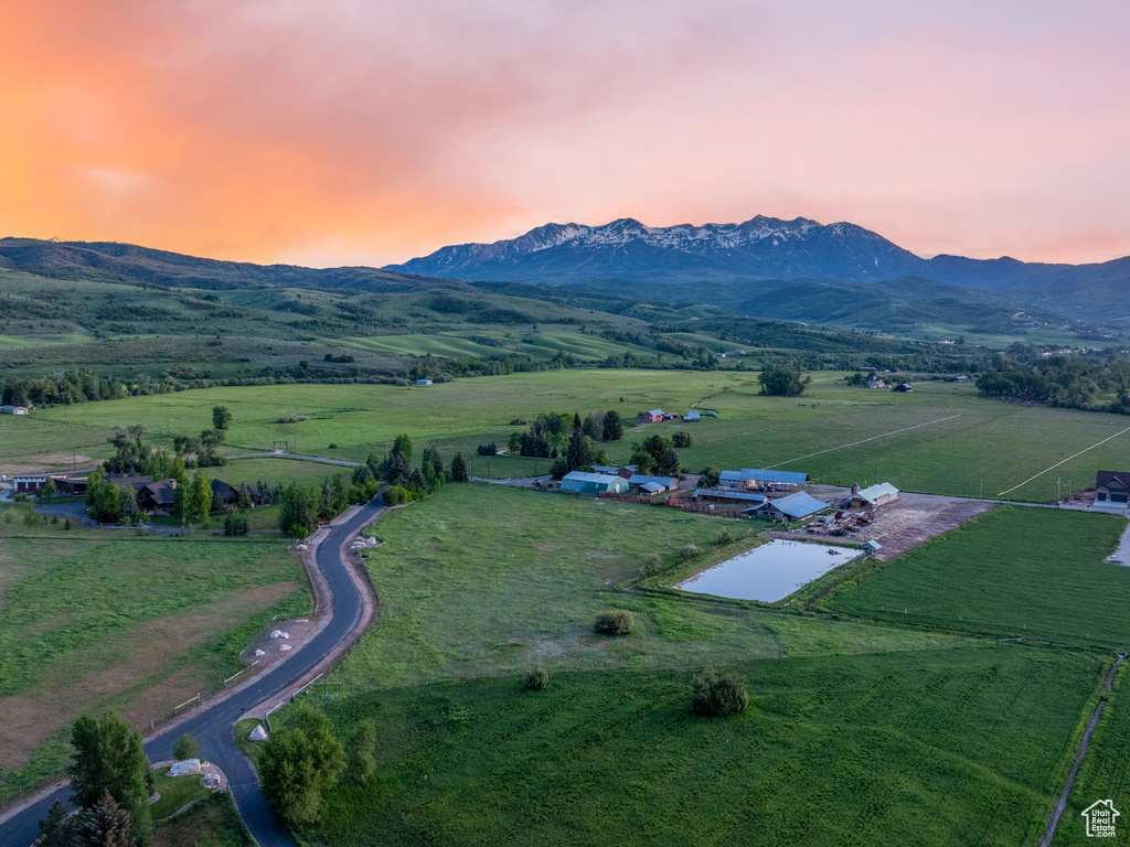 Overview of rural landscape with a mountain backdrop