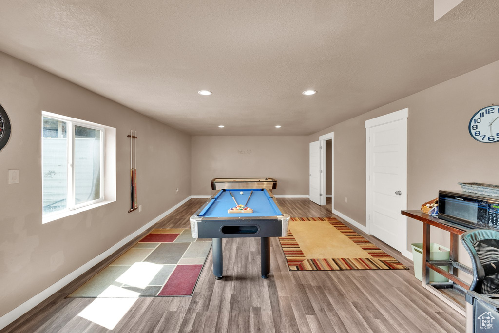 Rec room with billiards table, wood finished floors, baseboards, and recessed lighting