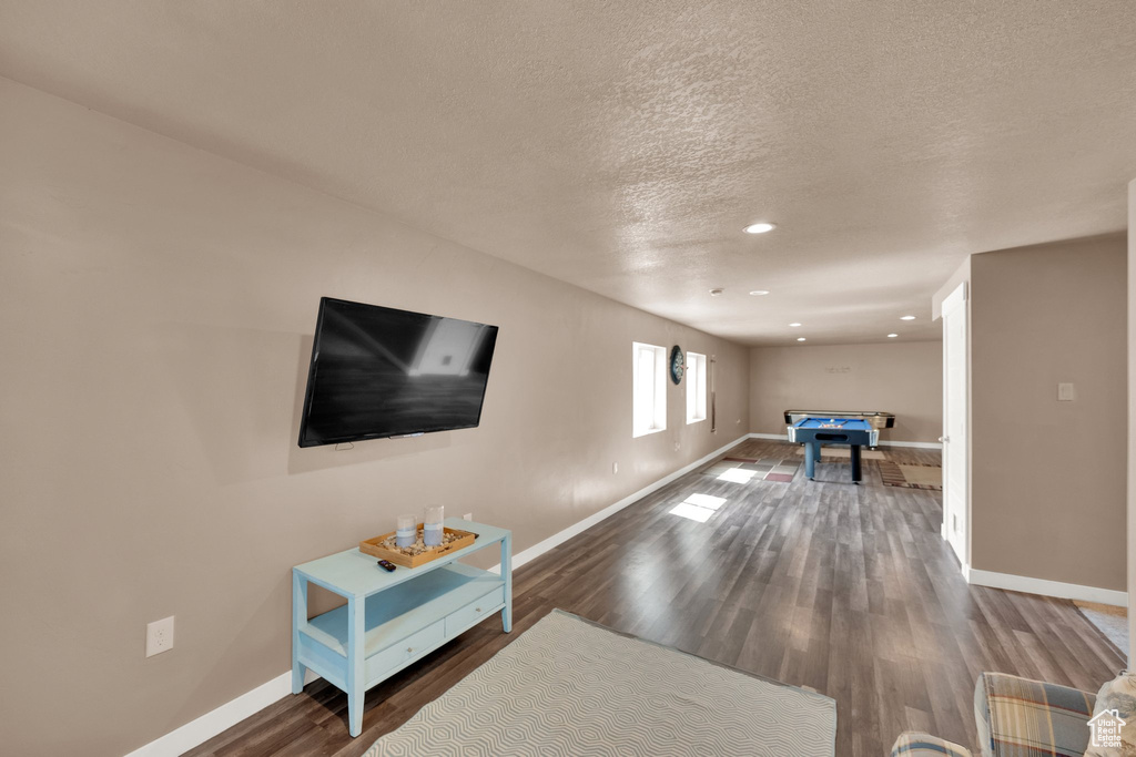Playroom with baseboards, pool table, wood finished floors, a textured ceiling, and recessed lighting