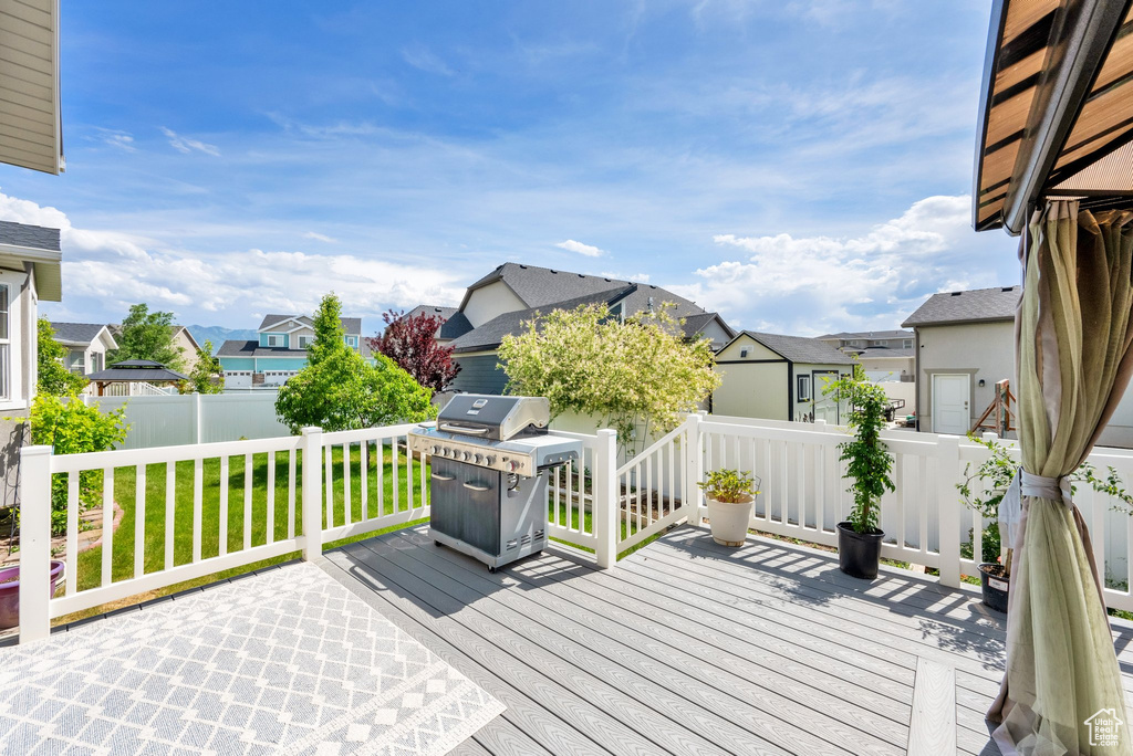 Wooden deck with a residential view