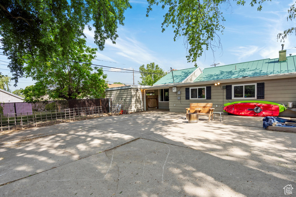 Back of house featuring a patio area and metal roof