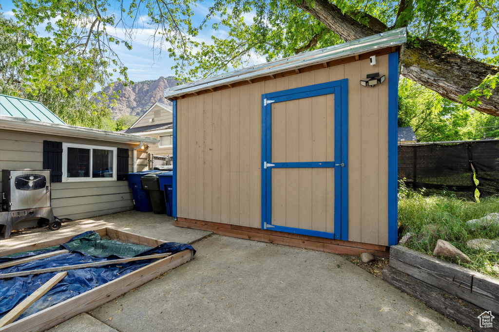View of shed with a mountain view