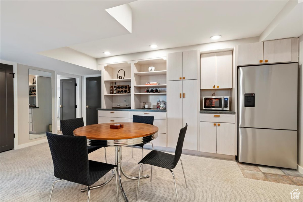 Dining space featuring recessed lighting