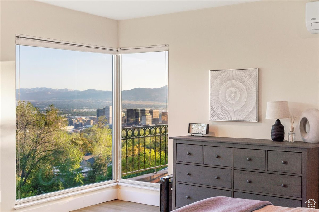 Bedroom featuring a mountain view and a wall mounted AC