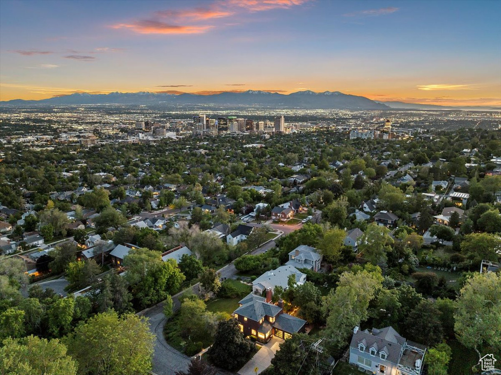 Aerial view of property's location with a mountain backdrop