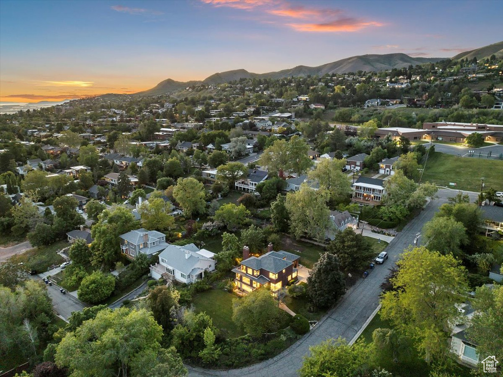 Aerial view of property's location with a mountain backdrop