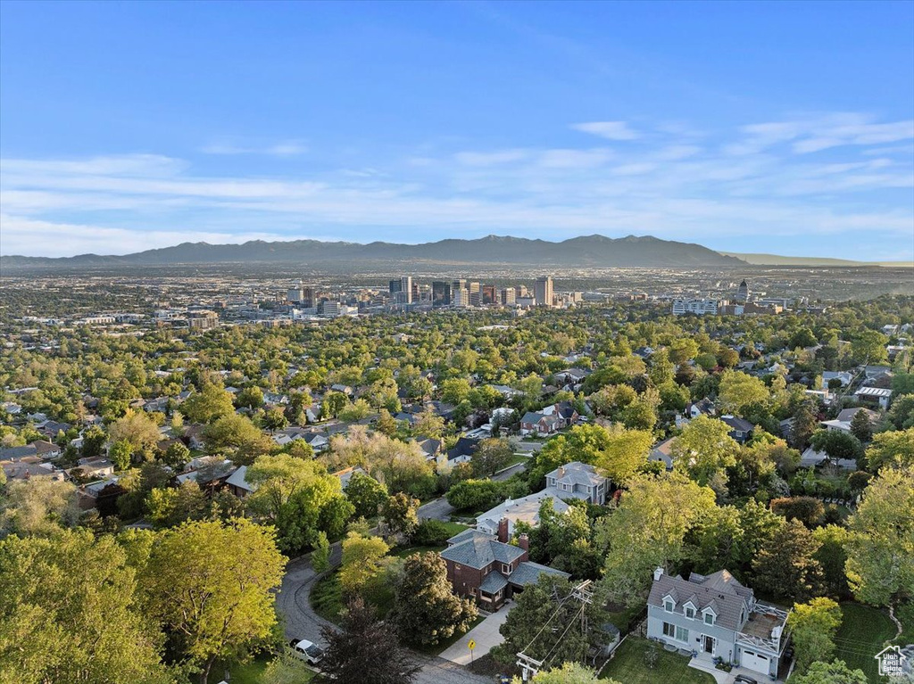 Aerial view of property's location with a mountain backdrop