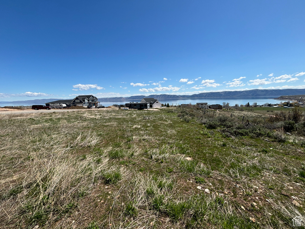 View of yard with a water view