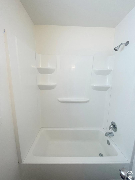 Bathroom featuring washtub / shower combination