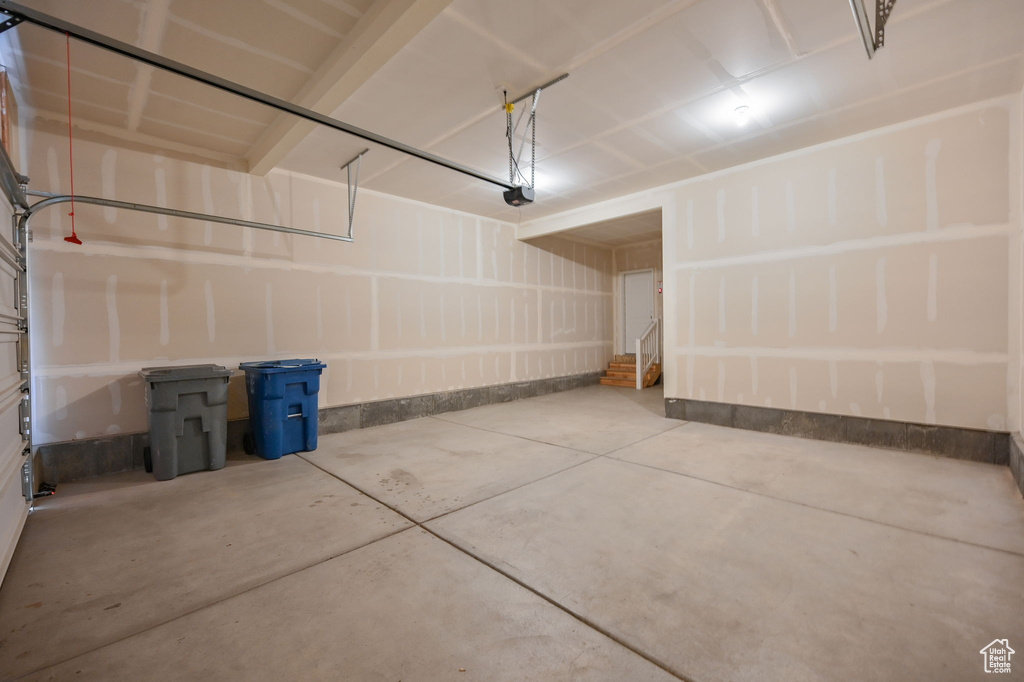 Garage featuring a garage door opener