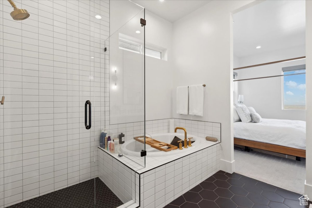 Ensuite bathroom featuring tile patterned floors, a stall shower, a garden tub, and recessed lighting