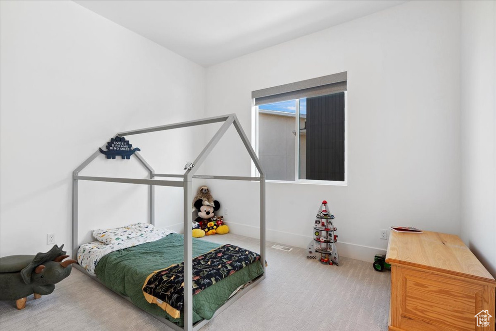 Bedroom with carpet and baseboards
