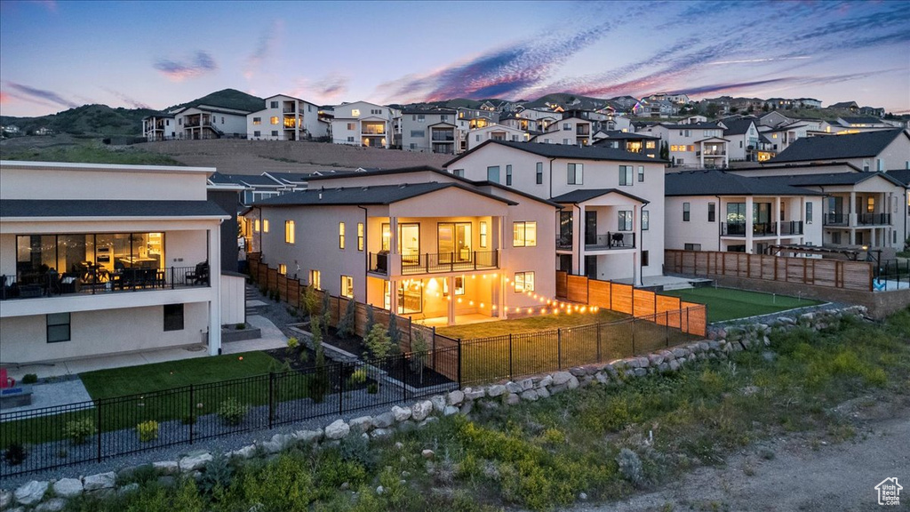Back of property with a residential view and a fenced backyard