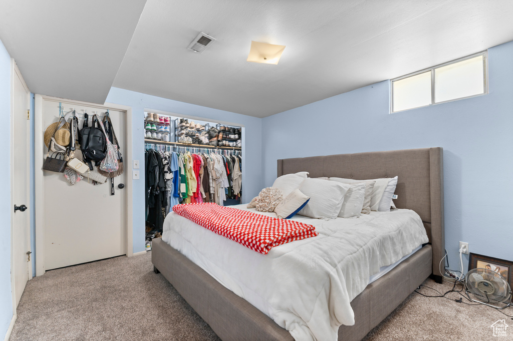 Bedroom with carpet flooring and a closet