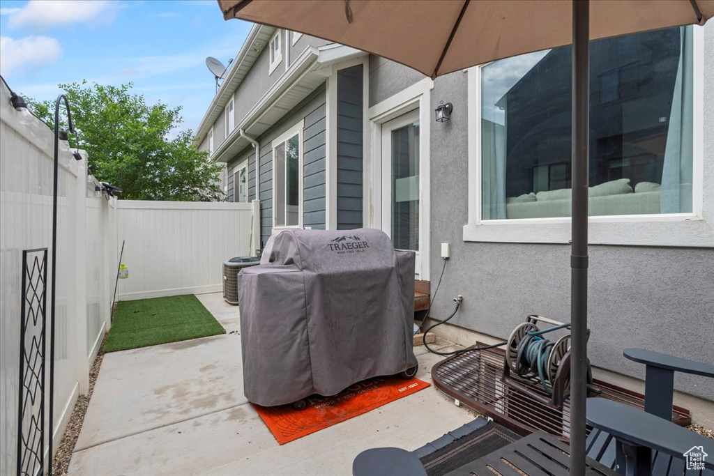 View of patio featuring a grill