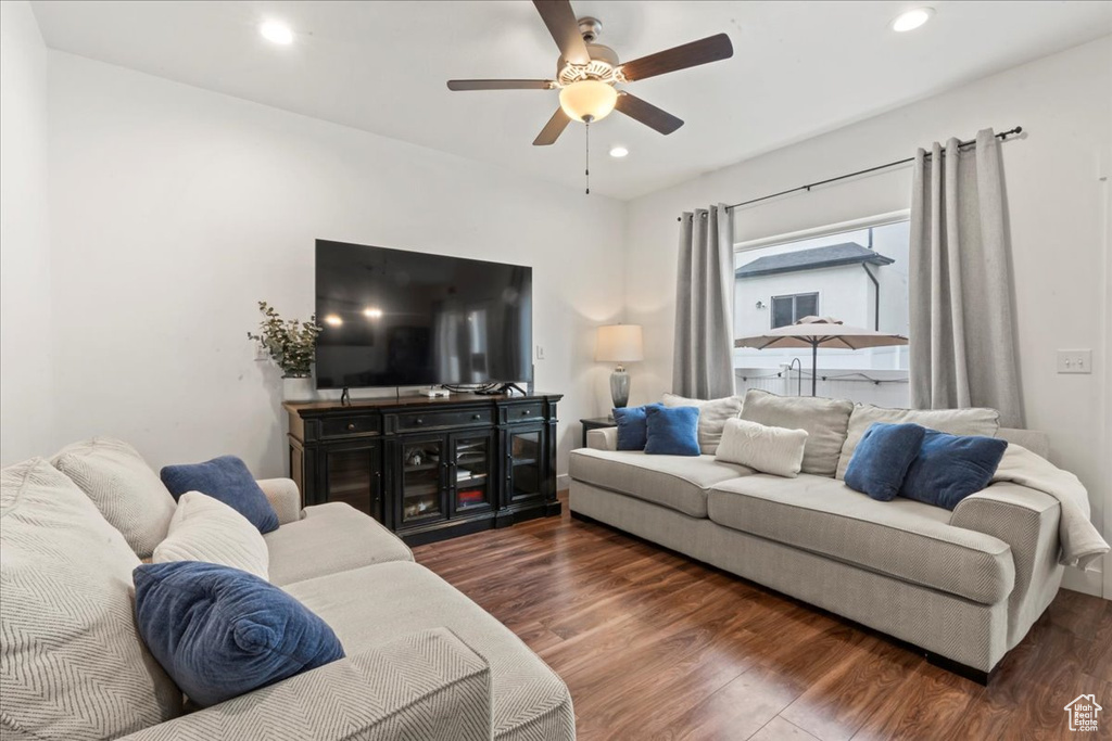 Living area featuring wood finished floors, a ceiling fan, and recessed lighting