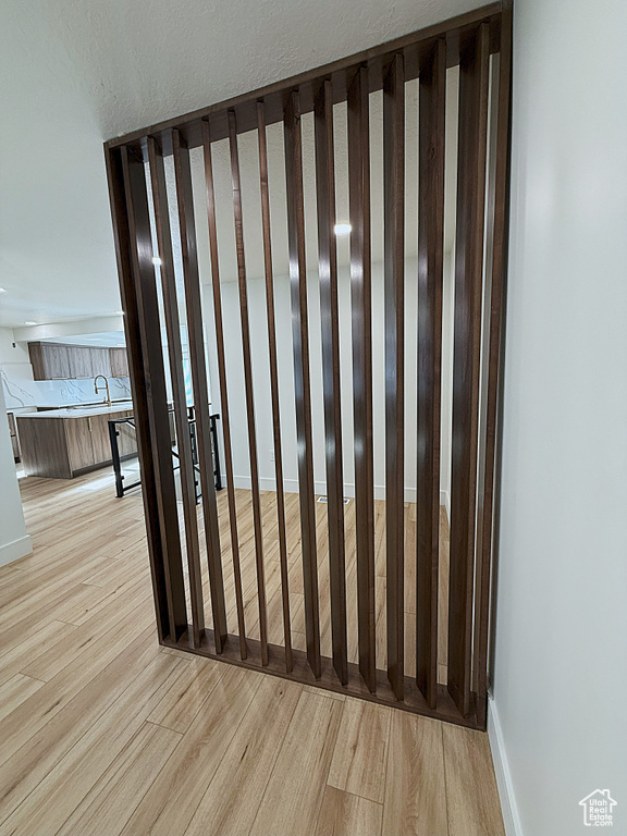 Detailed view of wood finished floors and baseboards