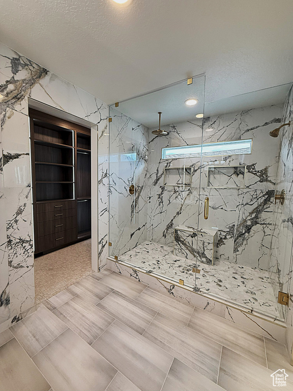 Interior space with a textured ceiling and recessed lighting