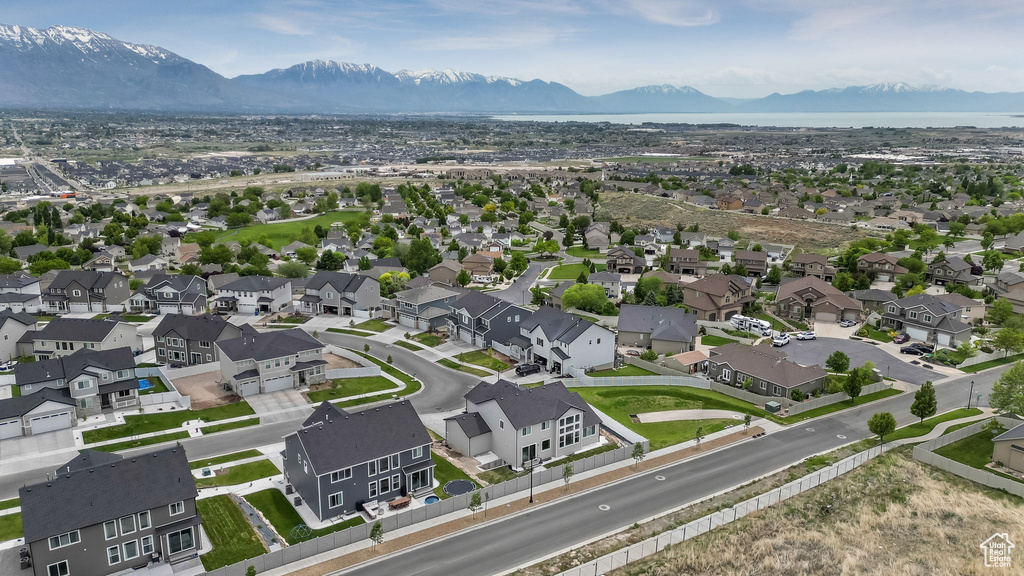 Aerial perspective of suburban area featuring a mountain backdrop