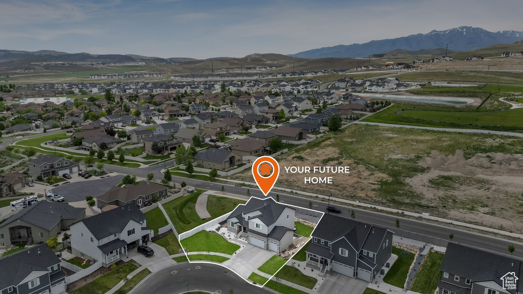 Aerial view of property\\\\\\\'s location featuring nearby suburban area and a mountainous background