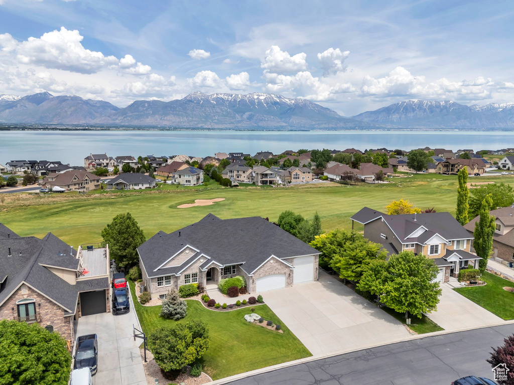 Aerial perspective of suburban area with a water and mountain view