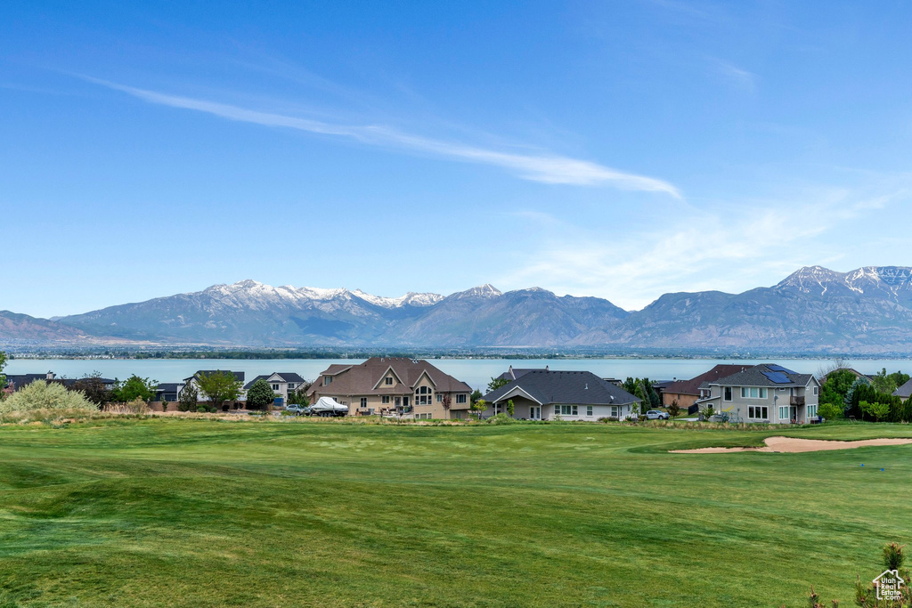Mountain view featuring a large body of water and nearby suburban area