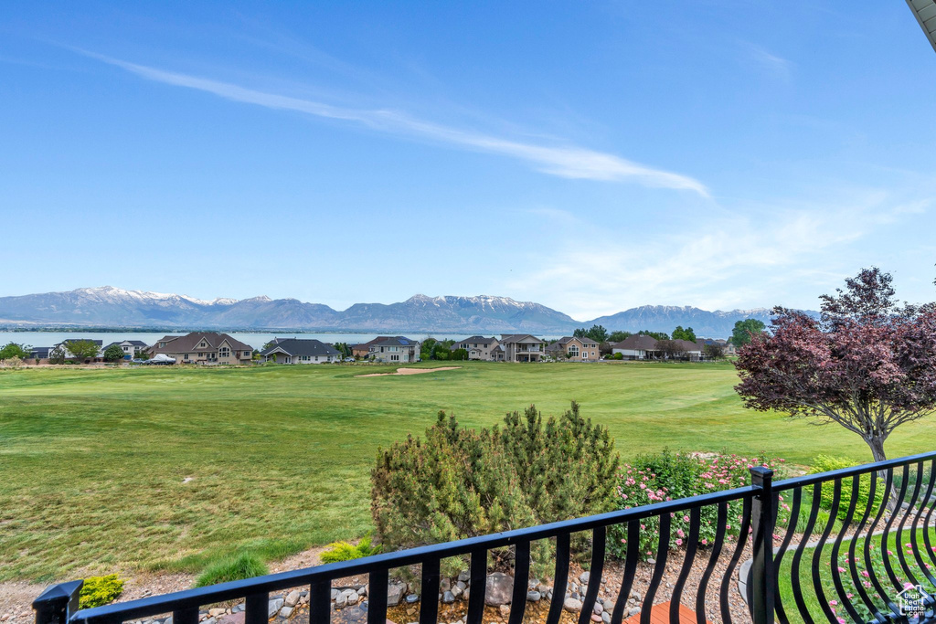 View of mountain backdrop featuring nearby suburban area