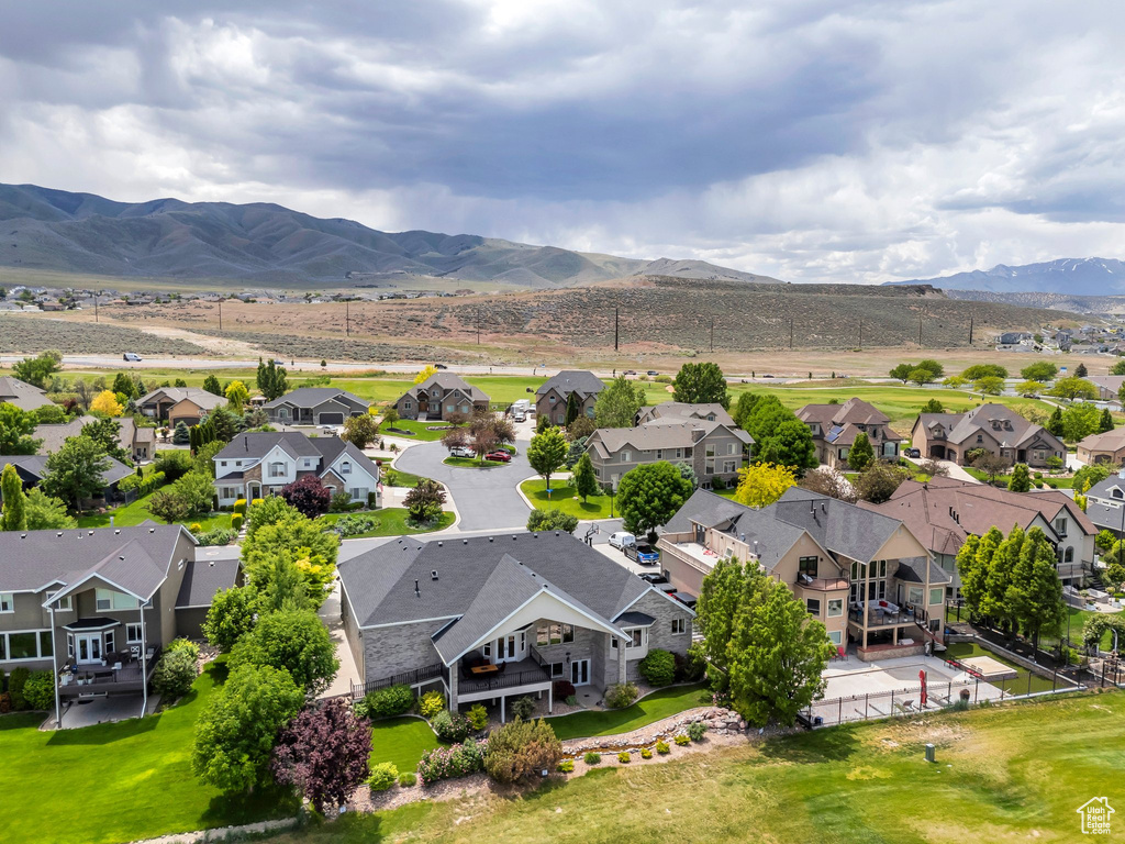 Aerial perspective of suburban area featuring a mountain backdrop