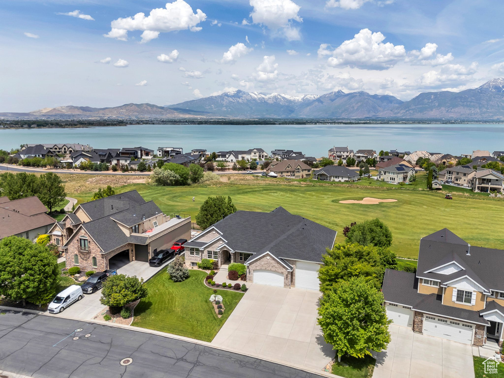 Aerial view of residential area featuring a water and mountain view