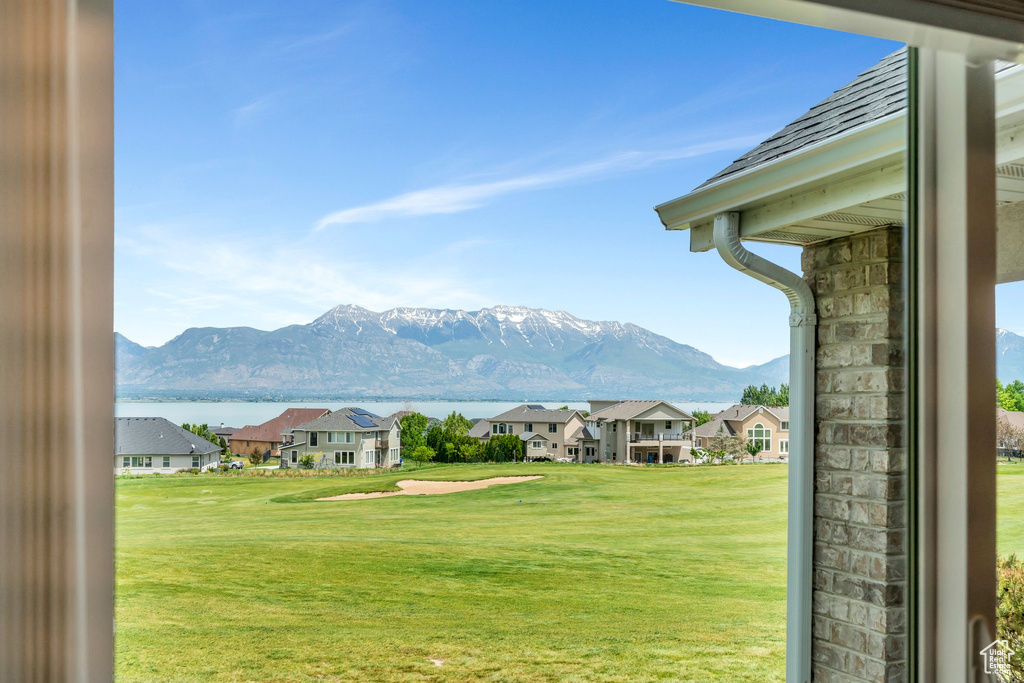 View of mountain backdrop featuring nearby suburban area