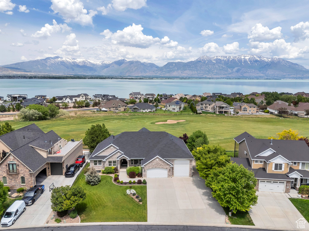 Aerial view of residential area featuring a water and mountain view