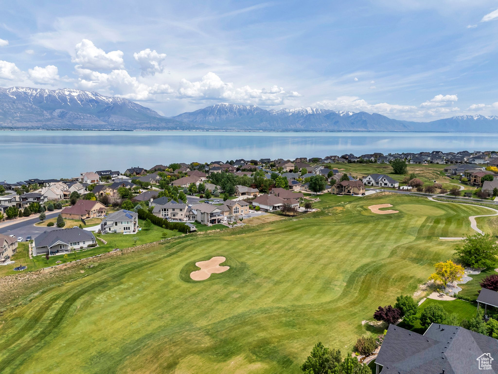 Aerial perspective of suburban area featuring a water and mountain view and a golf course