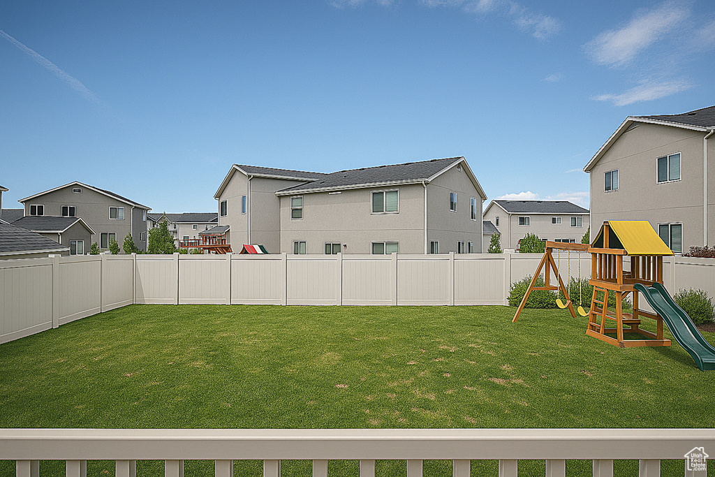 View of yard featuring a residential view and a playground