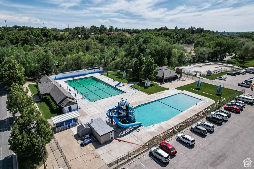 Aerial view of a pool area and a forest