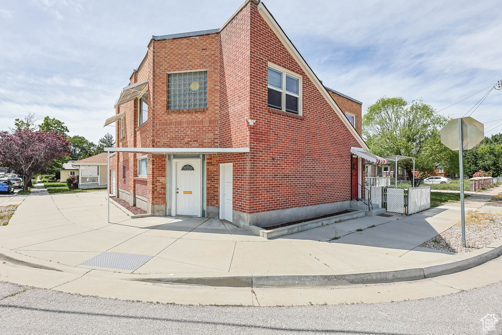 View of front of property featuring brick siding