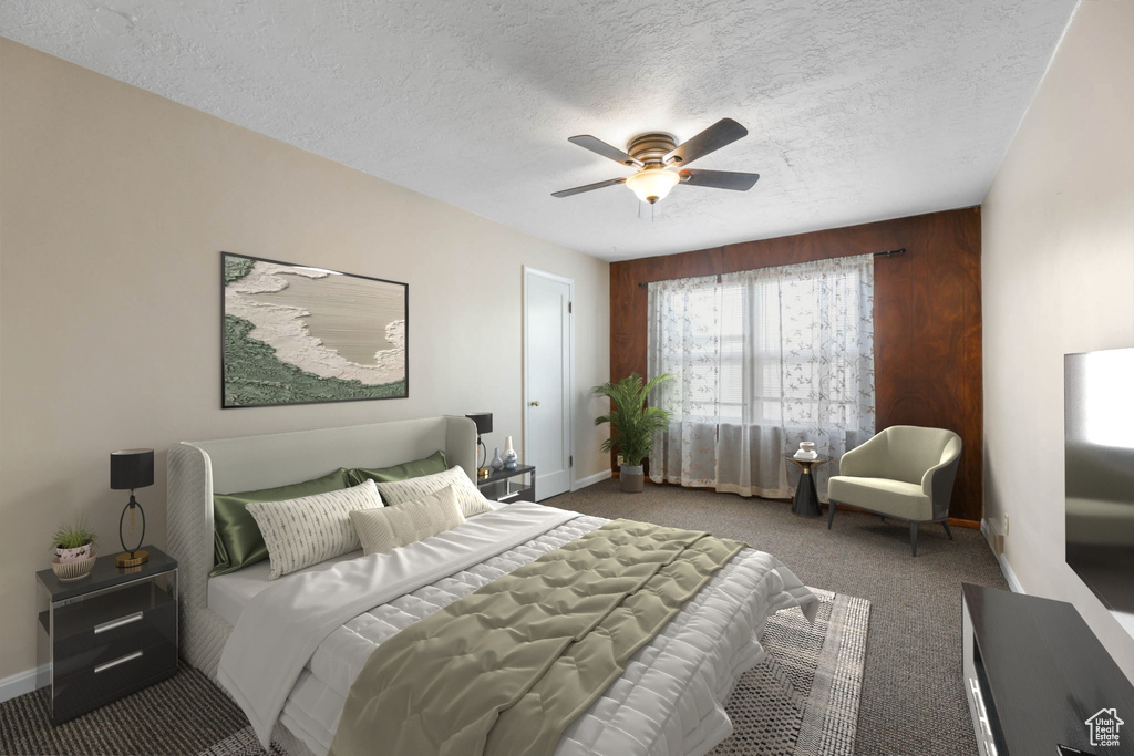 Bedroom featuring carpet flooring, baseboards, a textured ceiling, and ceiling fan