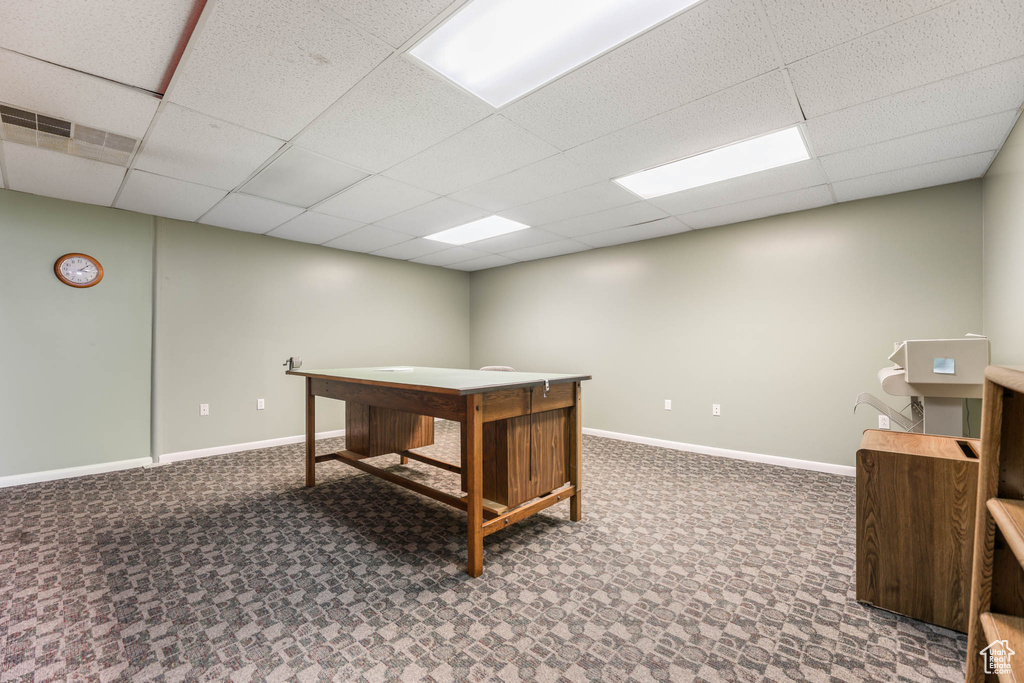 Home office with a drop ceiling, baseboards, and carpet floors