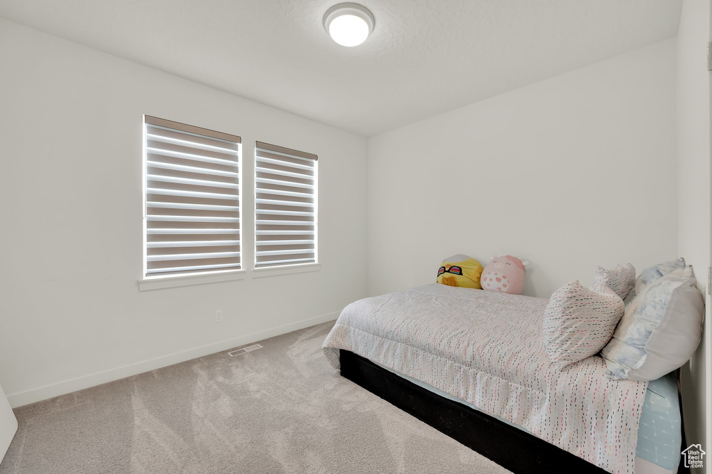 Bedroom with carpet and baseboards