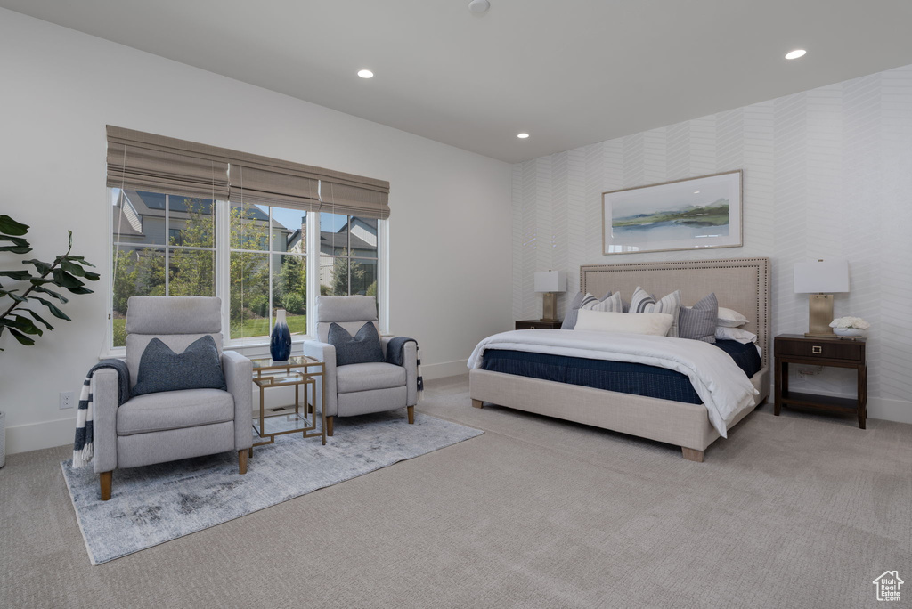 Bedroom with baseboards, carpet, wallpapered walls, recessed lighting, and an accent wall