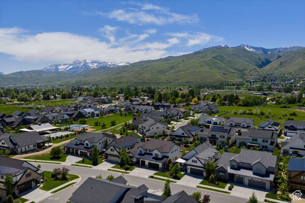 Aerial view of residential area featuring a mountain backdrop