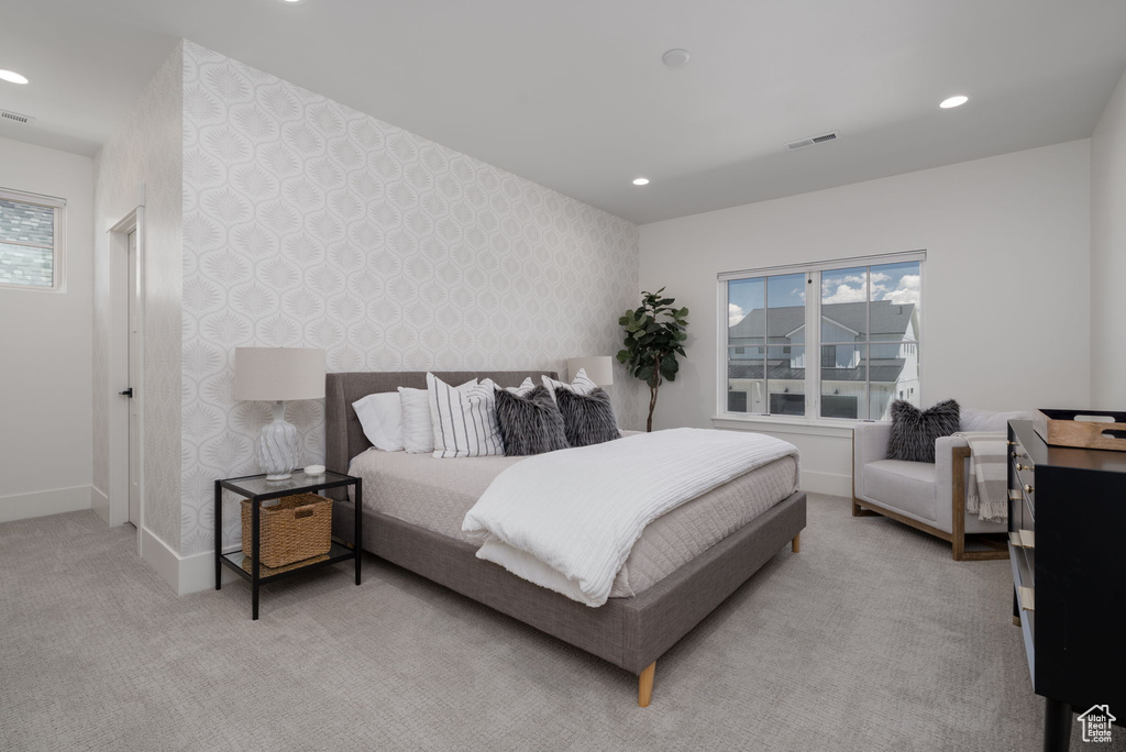 Bedroom featuring wallpapered walls, carpet floors, baseboards, and recessed lighting
