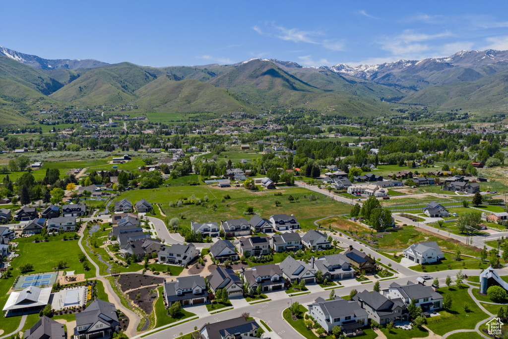 Aerial perspective of suburban area with a mountainous background