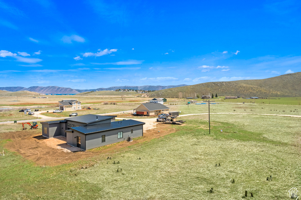 Aerial view of sparsely populated area featuring a mountain backdrop